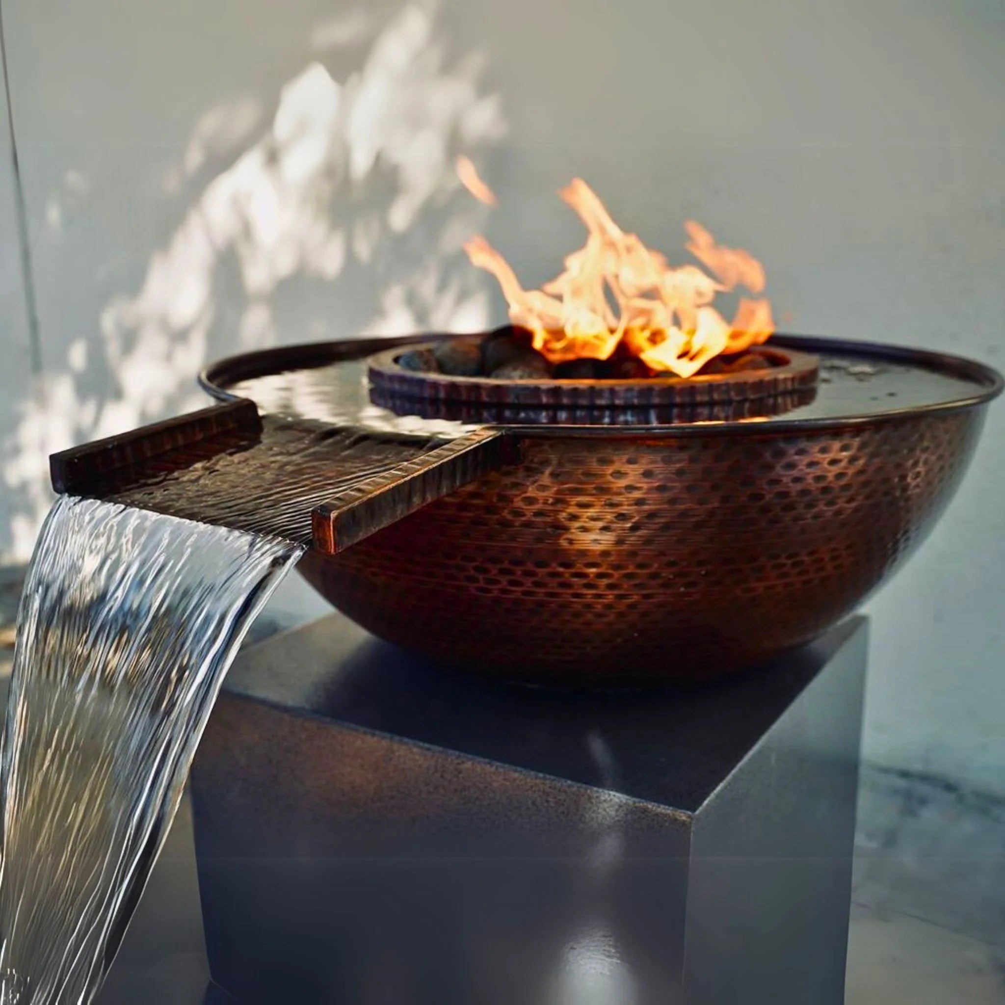 Fire pit with water feature on a reflective surface