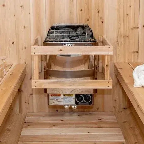 Elevate your relaxation experience with the Georgian Cabin Sauna, expertly handcrafted by Leisurecraft as part of the renowned Timber Collection. Constructed from Eastern White Cedar, this sauna showcases a light wood tone with charming tight knots, perfectly complementing any cottage or home aesthetic. 