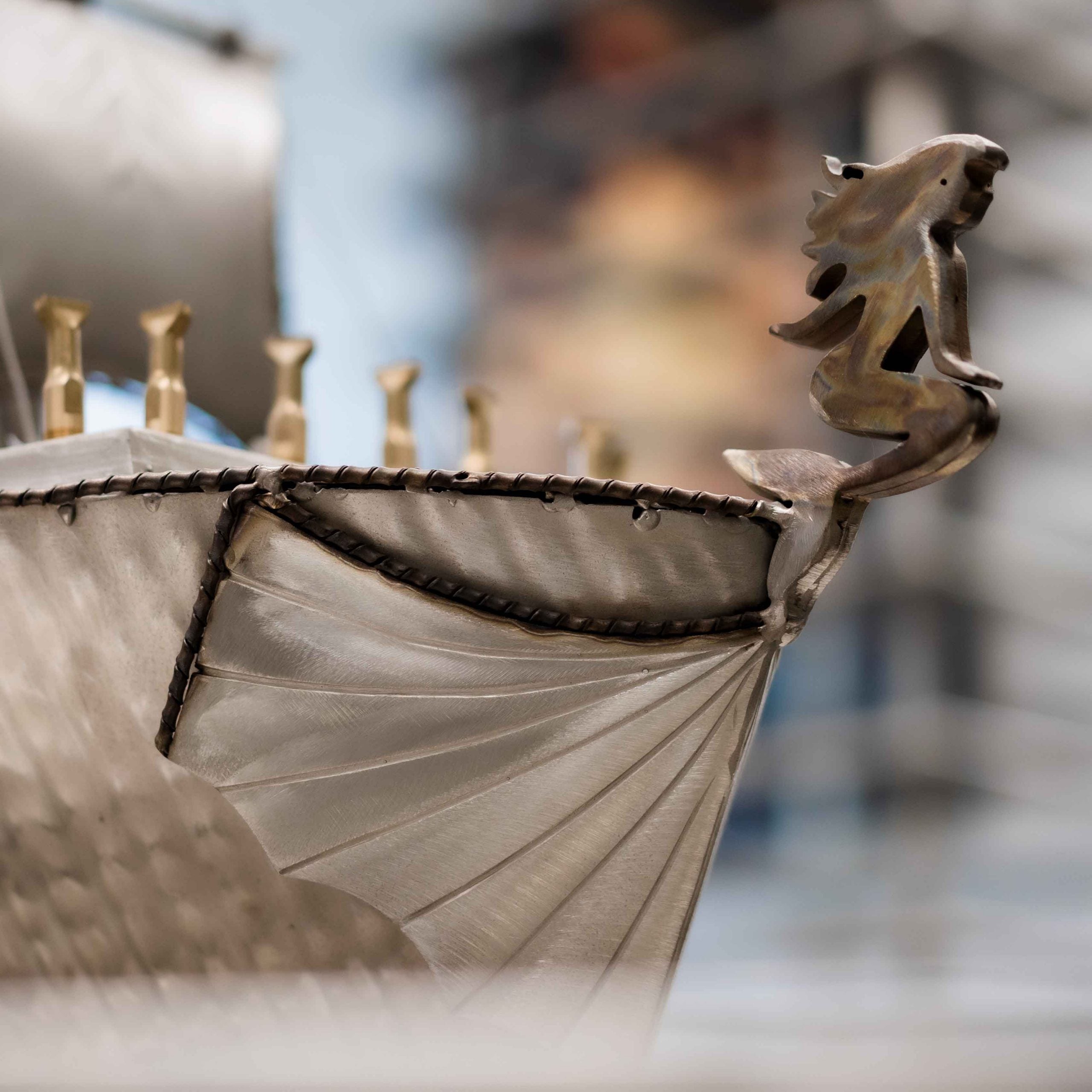 Close-up of a decorative ship figurehead with a blurred background